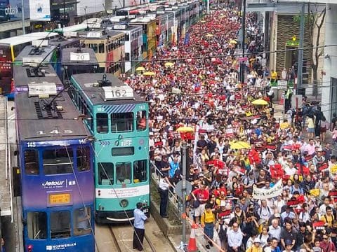 Tens of thousands march to protest against extradition bill