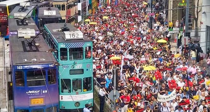 Tens of thousands march to protest against extradition bill
