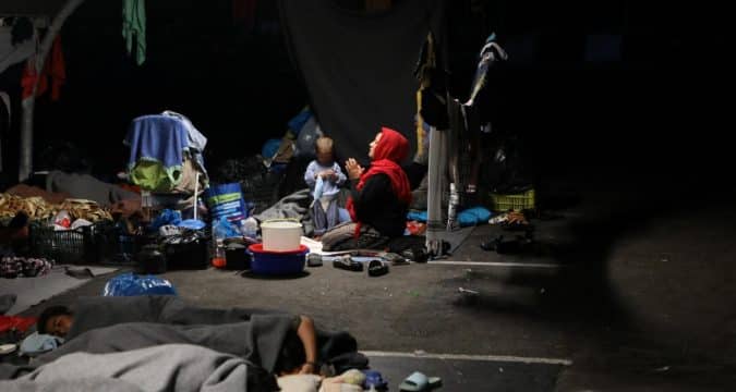 Edgy locals patrol streets in wake of devastating refugee camp blaze