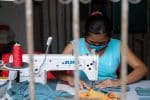A member of Project SOW sews face masks in Manila. Photo: UCAN/Angat Buhay