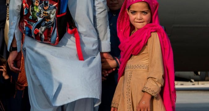 Reunite evacuated kids with parents, Vatican paper says