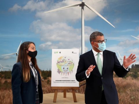Alok Sharma, president of the United Nations Climate Change Conference [COP26], with Emma Khadeh, winner of the Creative Earth art competition, during an event at the Whitelee wind farm, near Glasgow, Scotland, on May 14. Photo: CNS/Russell Cheyne, Reuters group