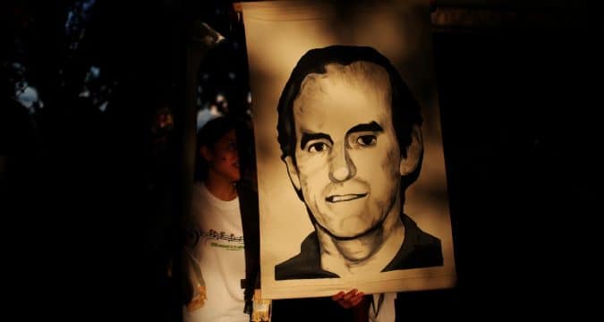 El Salvador charges former president with 1989 murders