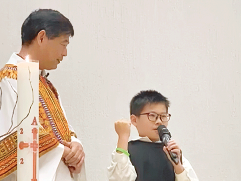 Child delegate spreads his blessings in parish