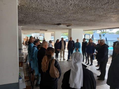 As Pope Francis leaves hospital, his almoner and doctors bring medical care to migrants