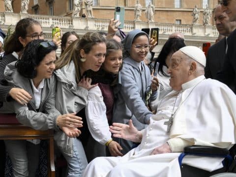 Carry the cross with compassion recovering pope says on Palm Sunday