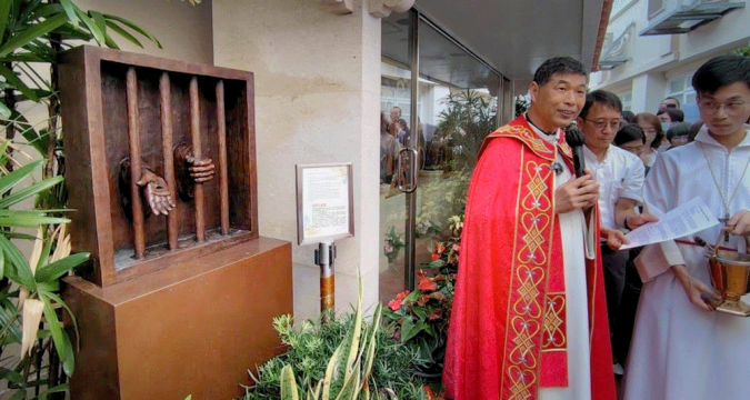 Blessing of sculpture evoking empathy for the incarcerated
