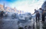Putting out fires in Qamishli, Syria, on October 11. Photo: CNS/Reuters