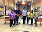Yat Hung-tam (centre) and the volunteers for the free vaccine service.