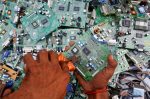 Salvaging circuit boards from discarded computer monitors in Karachi, Pakistan. Photo: CNS/Reuters