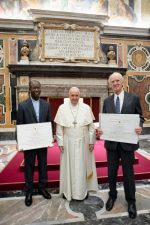 Pope Francis with Father Bere and Charles Taylor, winners of the Ratzinger prize, on November 9. Photo: CNS/Vatican Media