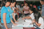 People look for their names on voter rolls during the 2013 barangay elections in Manila, the Philippines. File photo: UCAN