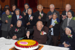 Father Chao, flanked by Sister Bernadette Hu (right) and Sister Magdalena Lui (left), surrounded by their fellow jubilarians, cuts the cake, during the tea reception at Caritas Hall on December 7.
