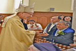Sister Kam shaking hands with John Cardinal Tong Hon during a Mass for jubilarians at the Cathedral of Immaculate Conception, Caine Road, on December 7.