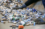 A worker in Krefeld, Germany, sorts used nonrechargeable lithium-ion batteries in preparation for recycling. File photo: CNS/Reuters