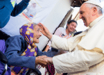 Pope Francis greets an elderly woman as he meets with people of the Banado Norte neighbourhood in Asuncion, during his July 2015 visit to Paraguay. File photo: CNS