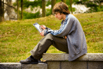 A teenager using an iPad. File photo: CNS/St. Louis Review
