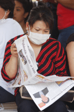 A migrant worker on their Sunday off. File photo