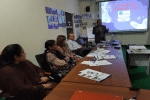 Nadeem Yousaf, standing, national humanitarian coordinator for Caritas Pakistan, briefs staff about the response to the Covid-19 outbreak. Photo: UCAN/Kamran Chaudhry