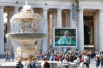 Pope Francis on a video monitor overlooking St. Peter’s Square as he leads the Angelus from the library in the Apostolic Palace on March. Photo: CNS