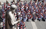 Priests seated below the statue of St. Peter as Pope Francis celebrates Mass marking the feast of Ss. Peter and Paul in St. Peter’s Square. File photo: CNS