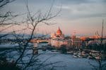 high-angle photography of dome building near bridge and body of water