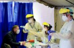 Medical personnel test a person for Covid-19 at Erasme Hospital in Brussels, Belgium on March 30. Photo: CNS/Reuters