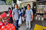 Father Puspo, of the Daya Dharma Institute, with Father Fredy Rante Taruk, left, executive director of Caritas Indonesia, preparing food packages for families affected by Covid-19. Photo: UCAN/Daya Dharma