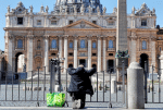 A solitary man in front of an empty St. Peter’s Square on March 25, joins in the worldwide recitation of the Lord’s Prayer, interceding for an end to the Covid-19 pandemic. Photo: CNS/Reuters
