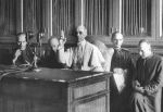 Pope Pius XII imparts a blessing at the end of a radio message on 1 September 1943. Just behind the pope is then-Father Giovanni Montini, the papal undersecretary of state, who would go on to become Pope Paul VI in 1963, succeeding Pope St. John XXIII. Photo: CNS photo