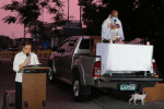Father Ronald Roberto celebrates Mass in a Manila street from the back of a pickup truck. Photo: UCAN/courtesy of Father Roberto