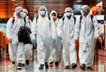 Seafarers who have spent months working onboard vessels during the Covid-19 pandemic arrive at Changi Airport in Singapore on June 12. Photo: CNS/Reuters