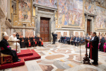 Pope Francis (left) listens as Gian Piero Milano (standing, right)the Vatican’s chief prosecutor, speaks during an audience on February 15. Photo: CNS/Vatican Media