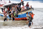 Rohingya refugees evacuated from a boat near the coast of Seunuddon beach in Aceh, Indonesia, on June 25. Photo: CNS/Antara Foto, Rahmad via Reuters