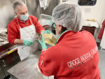 Red Cross volunteers working in a mobile kitchen in Rome's Portuense neighbourhood, preparing pasta for the homeless and the poor on April 3. Photo: CNS