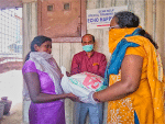 Volunteers giving food to people in need in India during the pandemic.