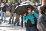People wearing face masks line up and wait to enter a pharmacy in Cochabamba, Bolivia, on July 21. Photo: CNS/Reuters