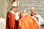 Pope Francis places a pallium on Cardinal Re on June 29. Photo: CNS