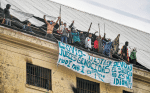 Prisoners protest in late April on the roof of the Devoto prison in Buenos Aires, Argentina, demanding action on overcrowding during the Covid-19 pandemic. Photo: CNS/Latin America News Agency via Reuters
