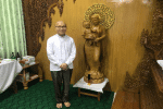 Archbishop Marco Tin Win with Burmese-style wooden images of Mary and the Infant Jesus at the chapel in the priests' centre in Mandalay on August 11. Photo: UCAN
