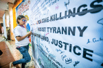 Zara Alvarez signing a manifesto signifying her commitment to work for human rights on 22 August 2019. Photo: UCAN/Mark Saludes