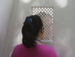 A young woman is pictured in a file photo during confession. Photo: CNS