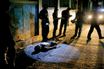 Philippine police with the body of an alleged drug user in Quezon City in October 2016. Photo: CNS/Reuters