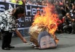 A protester burns an effigy of former Philippine dictator, Ferdinand Marcos, in Manila in 2016. Photo: CNS/Reuters