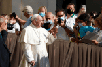 Pope Francis greets the crowd as he arrives for his general audience in the San Damaso courtyard at the Vatican on September 9. Photo: CNS