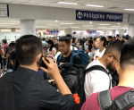 Travellers crammed into the immigration queue at Manila’s Ninoy Aquino Airport in January. Today, migrant workers are still travelling out of the Philippines to work but many are being prevented because of Covid-19.