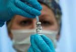 A nurse prepares Russia’s Sputnik-V Covid-19 vaccine in a post-registration trials stage at a clinic in Moscow. Photo: CNS/Reuters