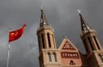 The Chinese flag is pictured in front of a Catholic church in the village of Huangtugang. Photo: CNS/Reuters