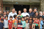 Local Hmong villagers gather around Father Peter Nguyen Truong Giang, and Auxiliary Bishop Peter Nguyen Van Vien of Vinh, centre, at Hau Thao chapel in late September. Photo: CNS/UCAN