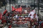 File photo of workers emerging from an underpass in Manila during a Labour Day protest march. Photo: UCAN/Basilio Sepe